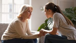 Woman Talking to Mother About Assisted Living