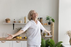 Joyful older woman at home.