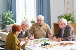 Seniors playing board games.