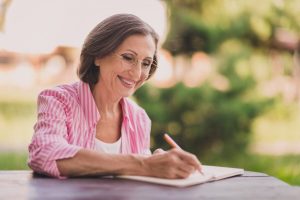 Older woman writing